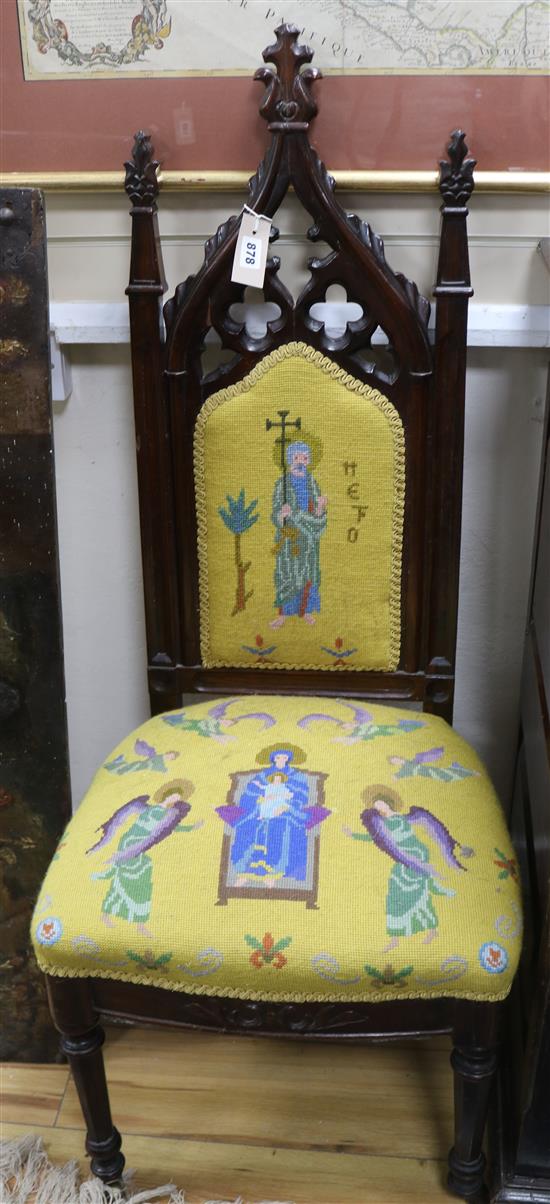A Victorian rosewood nursing chair in the Gothic Revival manner,